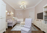 Ceiling Medallion surrounds elegant light fixture in a luxurious white room. 